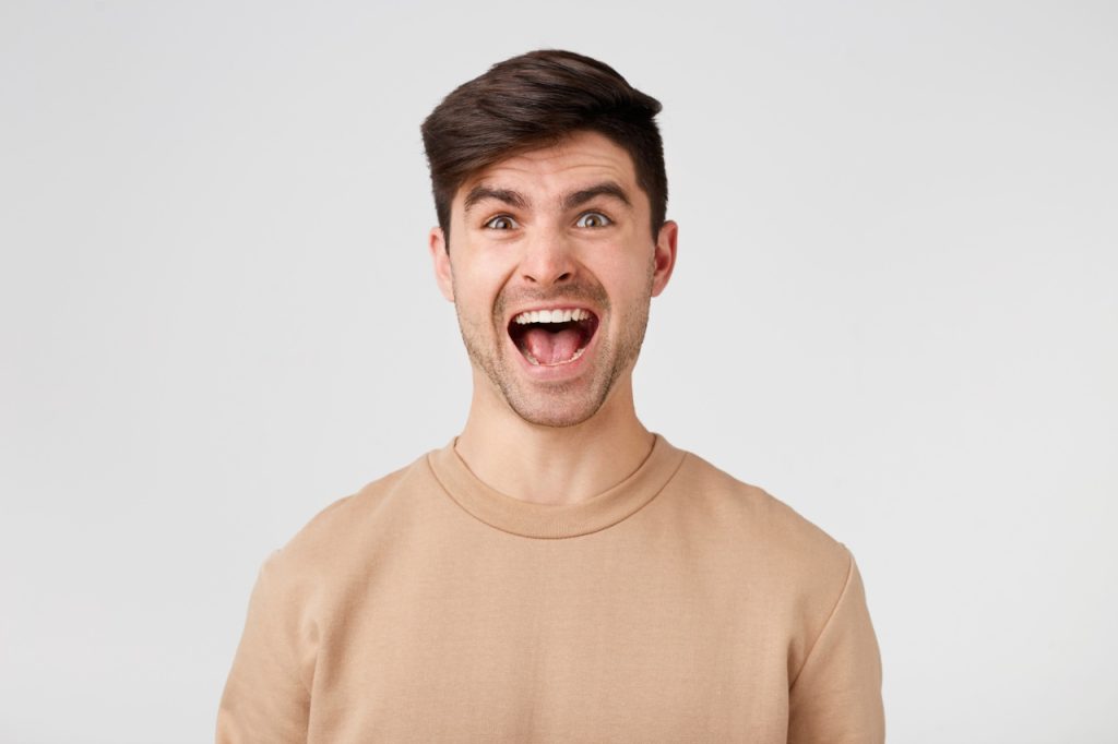 handsome man with his mouth wide open